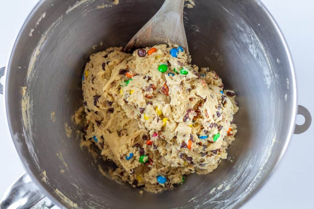 mixed cookie dough with extra toppings stirred in a bowl