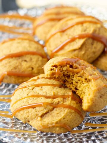 pumpkin cookies with caramel drizzled over the top.