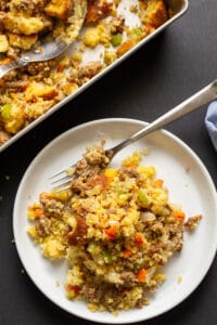 stuffing on a white plate with a black background