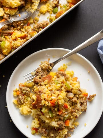 stuffing on a white plate with a black background