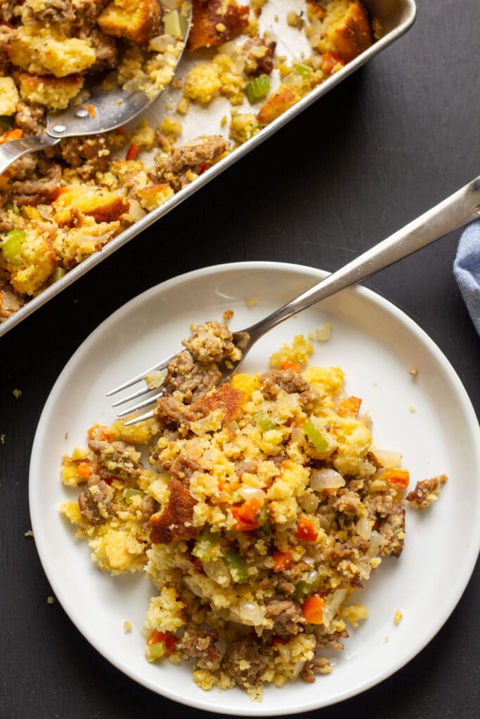 stuffing on a white plate with a black background 