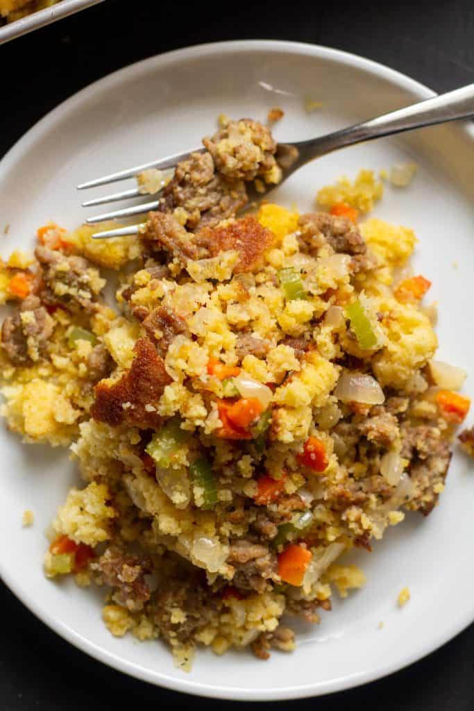 stuffing on a white plate with a black background