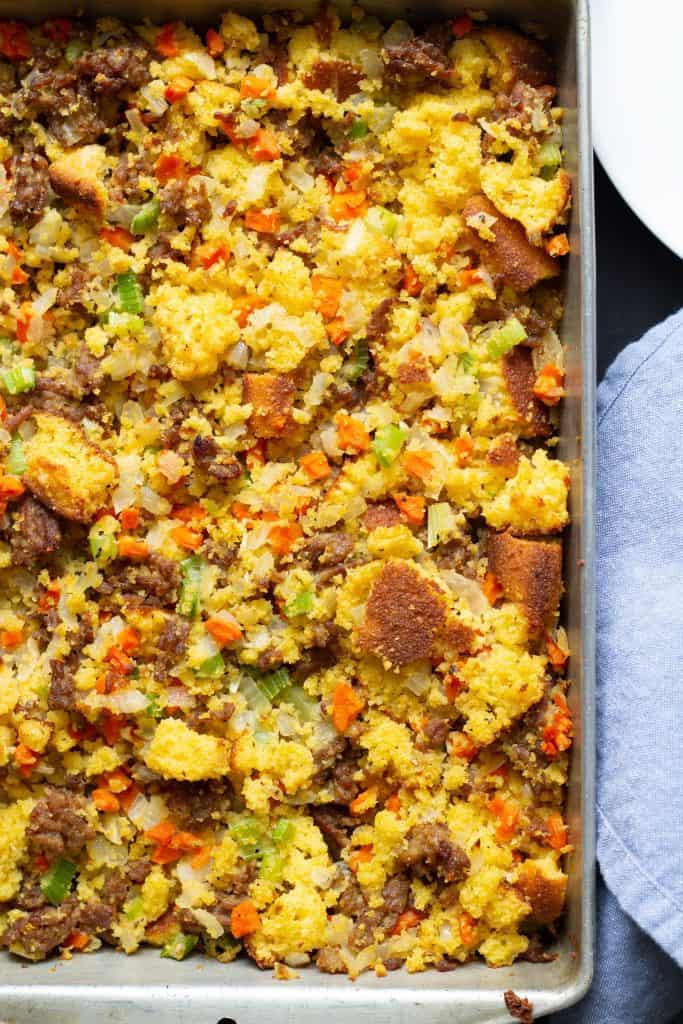 stuffing on a white plate with a black background