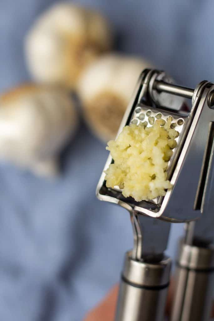 Why You Shouldn't Peel Your Garlic When You Use a Garlic Press