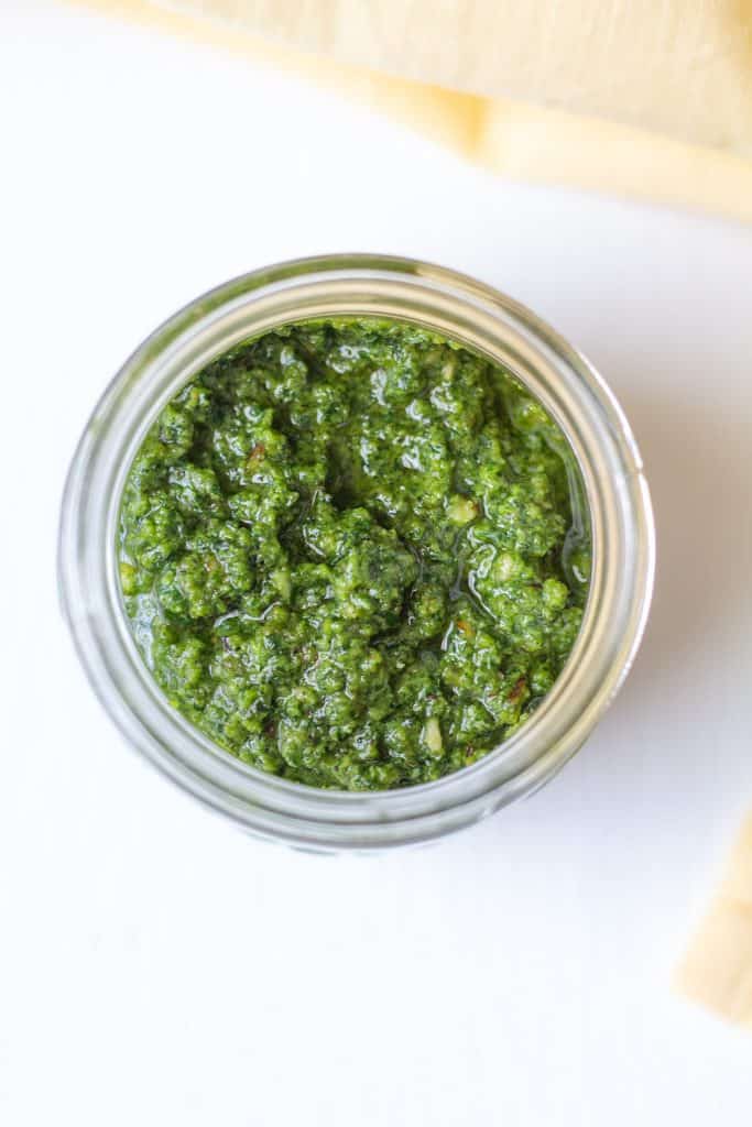 pesto in a jar on a white background