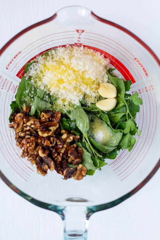 walnuts, cheese, garlic, basil, salt, olive oil in a bowl