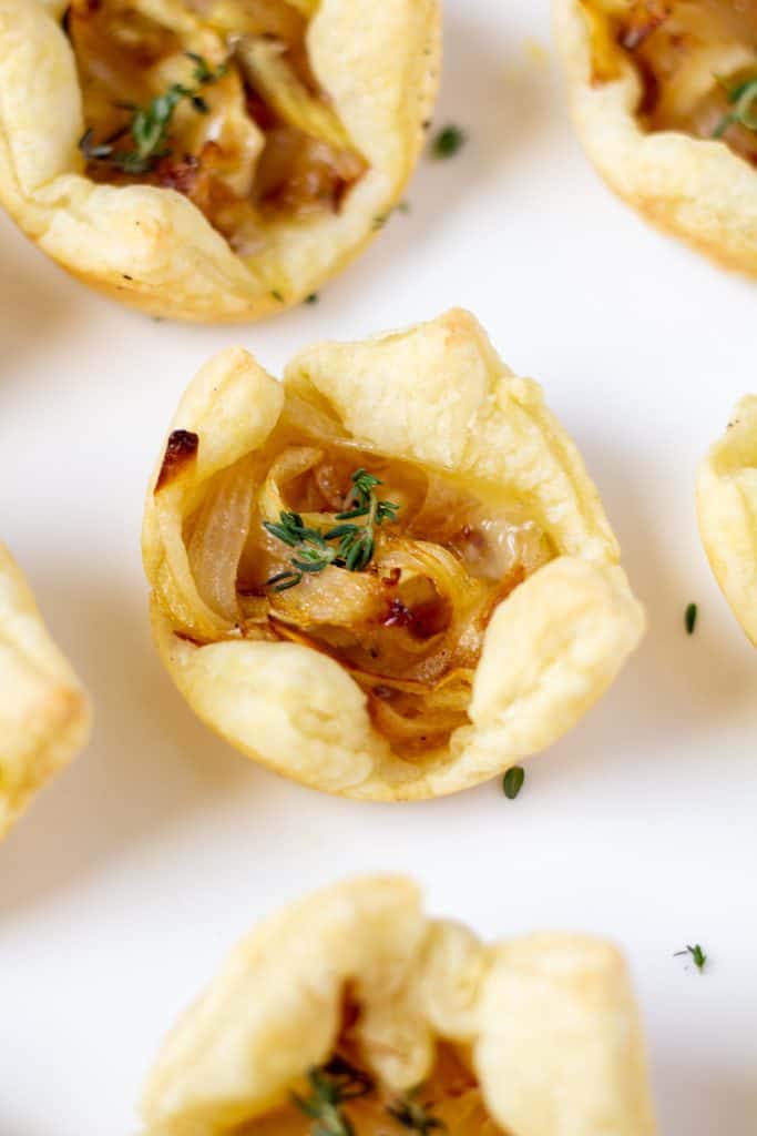 puff pasty appetizer bites on a white plate