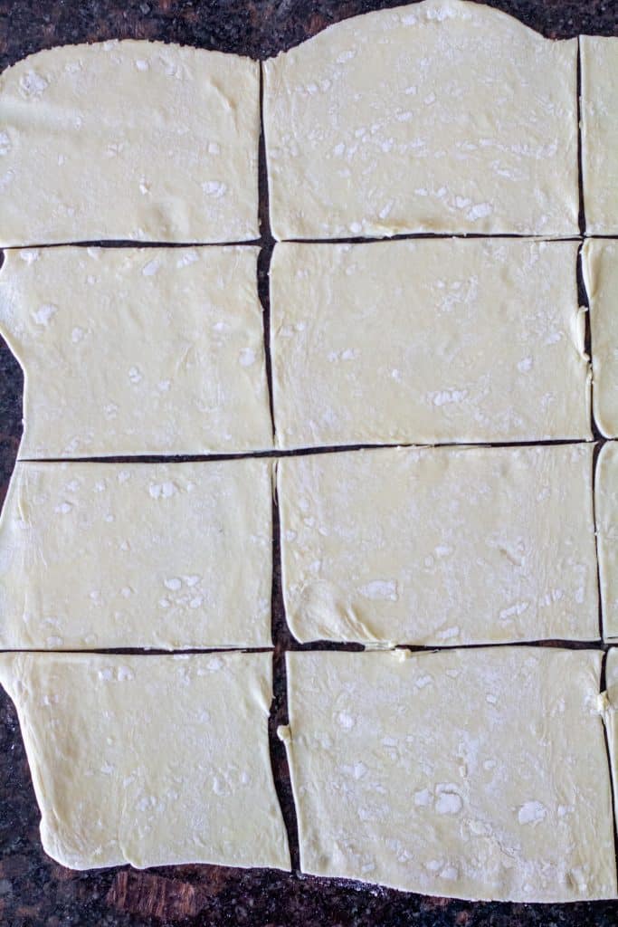 puff pastry cut into squares on the counter