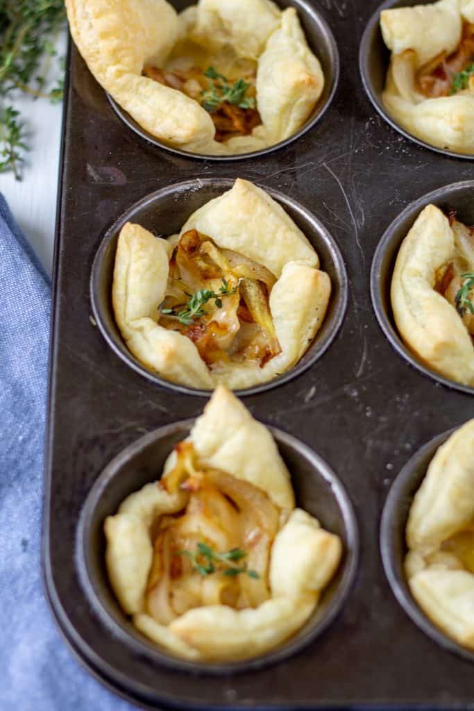 cooked pastry puffs bites with filling in a muffin sheet