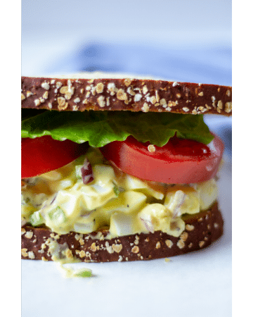 egg salad sandwich on a white background