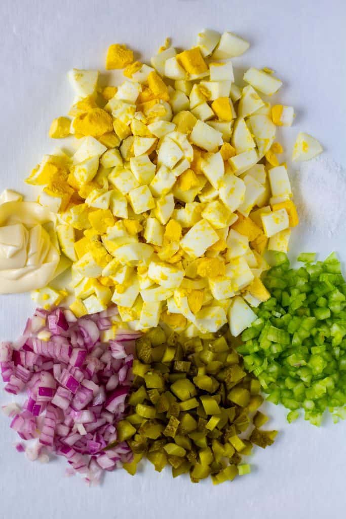 deconstructed egg salad on a white background