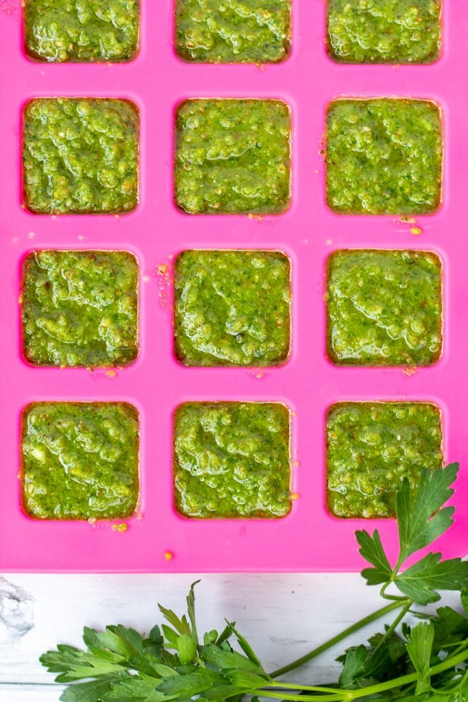 sauce in squares in a pink silicone mat