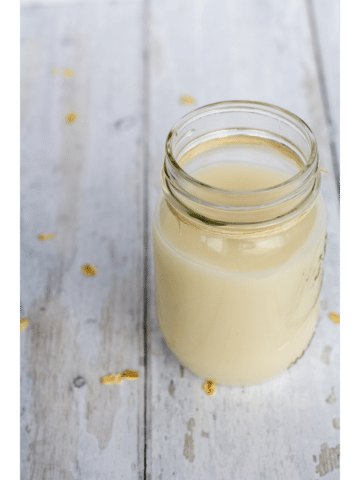 oat milk in a glass jar with a white background