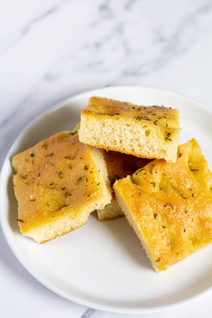 4 pieces of bread on a white plate