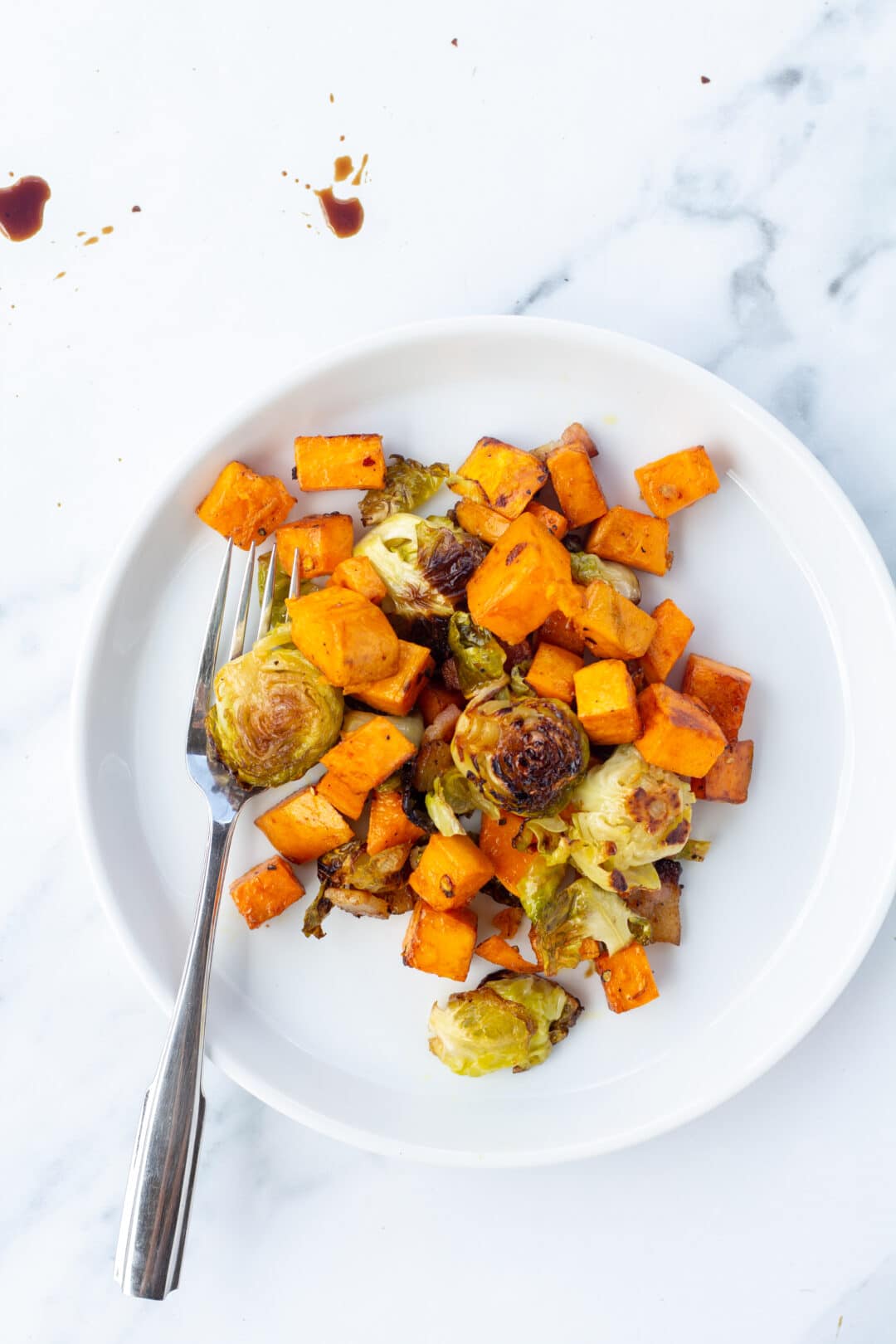 Simple Roasted Brussel Sprouts and Sweet Potatoes with Bacon Salty