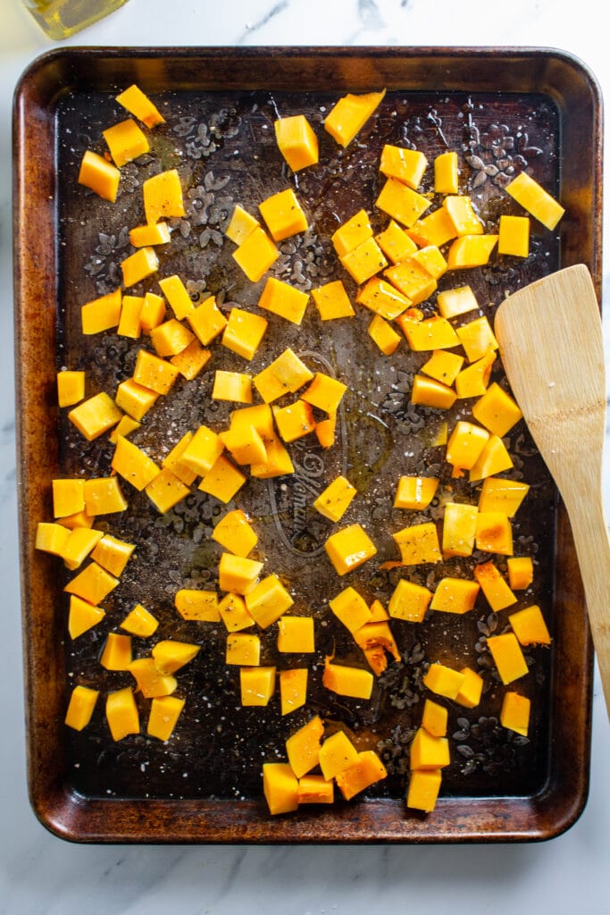 Butternut squash on a weathered baking sheet