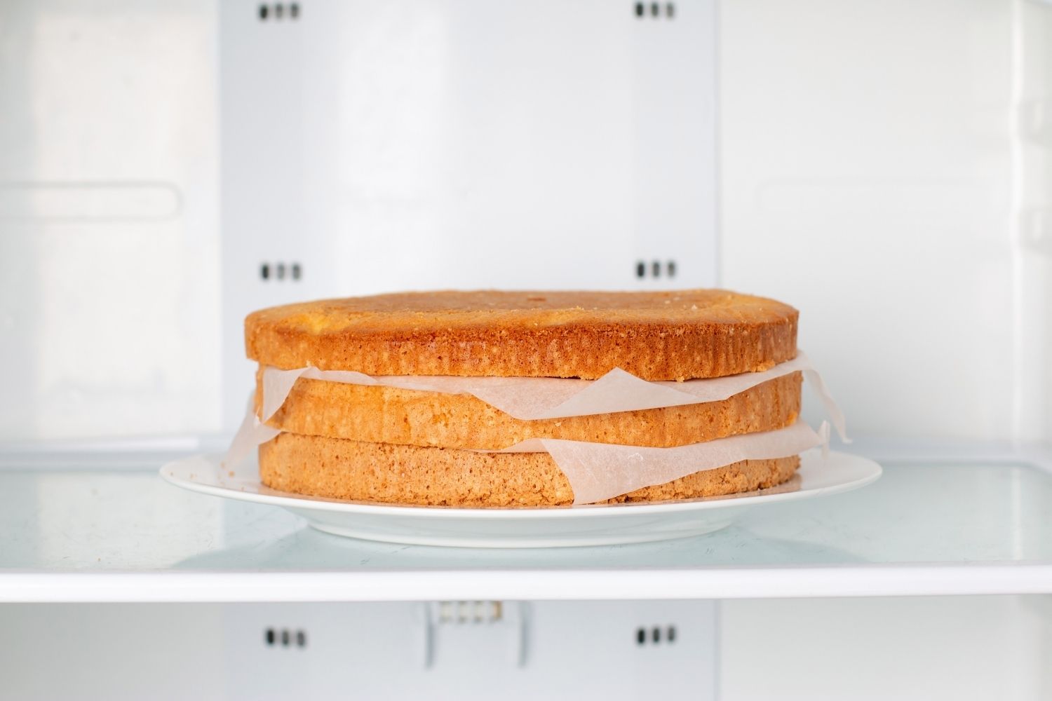 layers of cake in a freezer