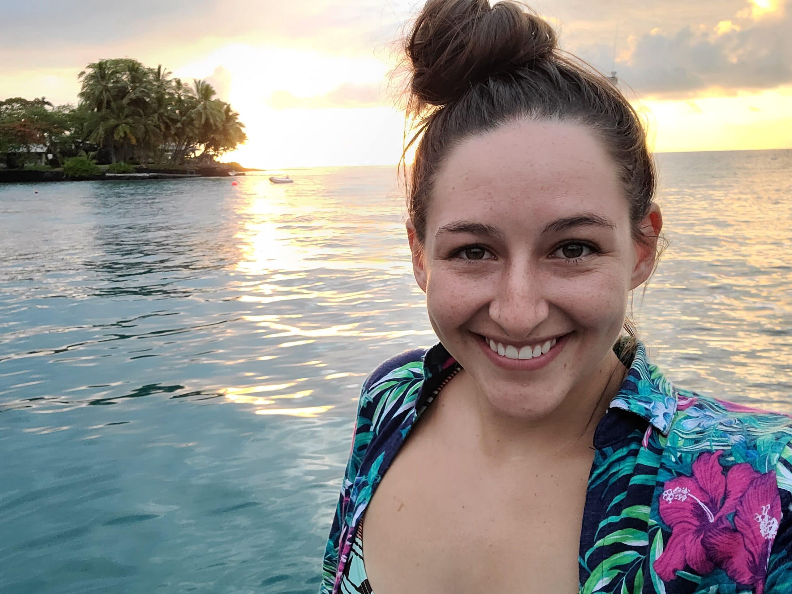 photo of a woman in front of a beach