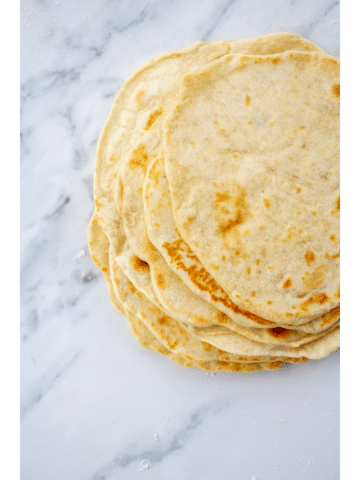 stack of tortillas on a marble background