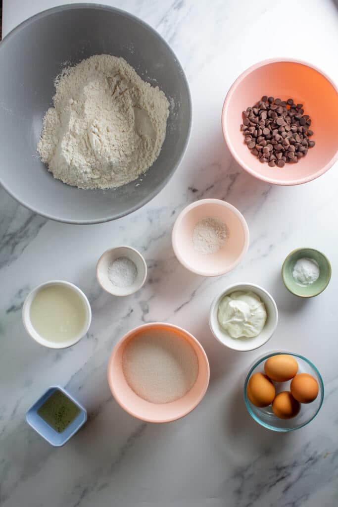 All the ingredients in small bowls on a white background