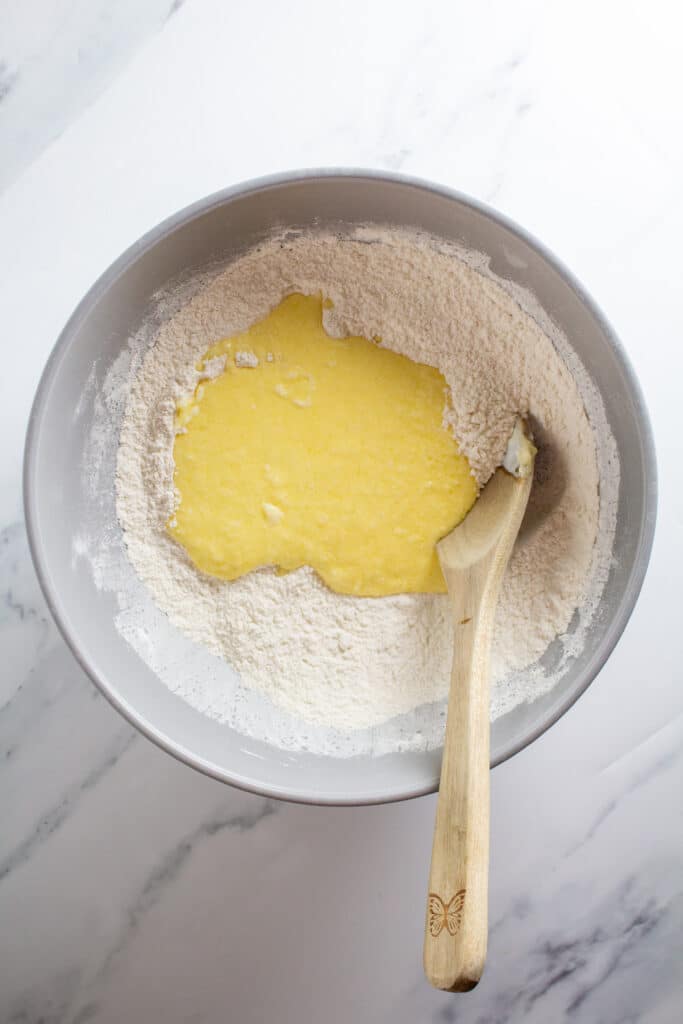 A bowl of dry ingredients with wet on top