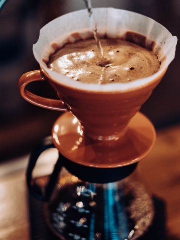 pour-over coffee filtering into a pot