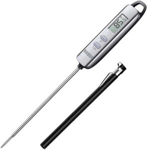 a digital kitchen thermometer with a case for the needle next to it