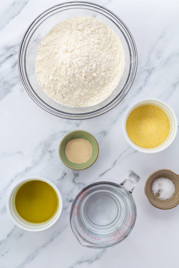 pizza dough ingredients on a marble counter