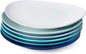 A stack of blue based plates with white on top