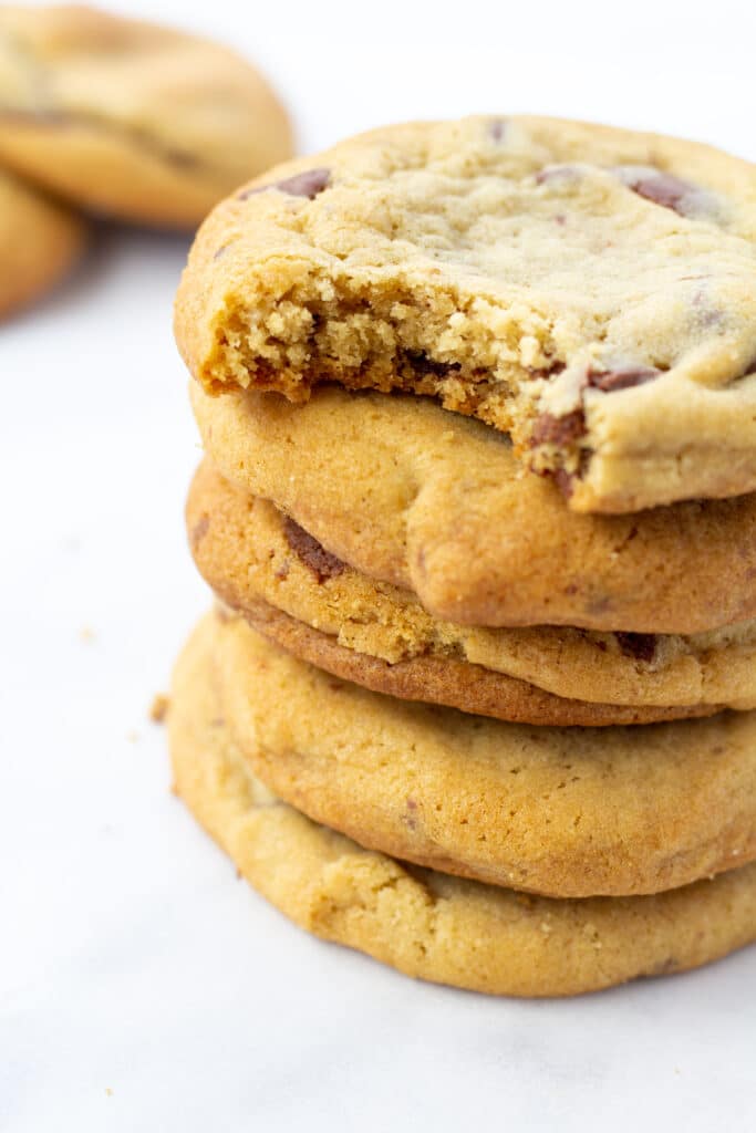 stack of fluffy cookies with top cookie bitten