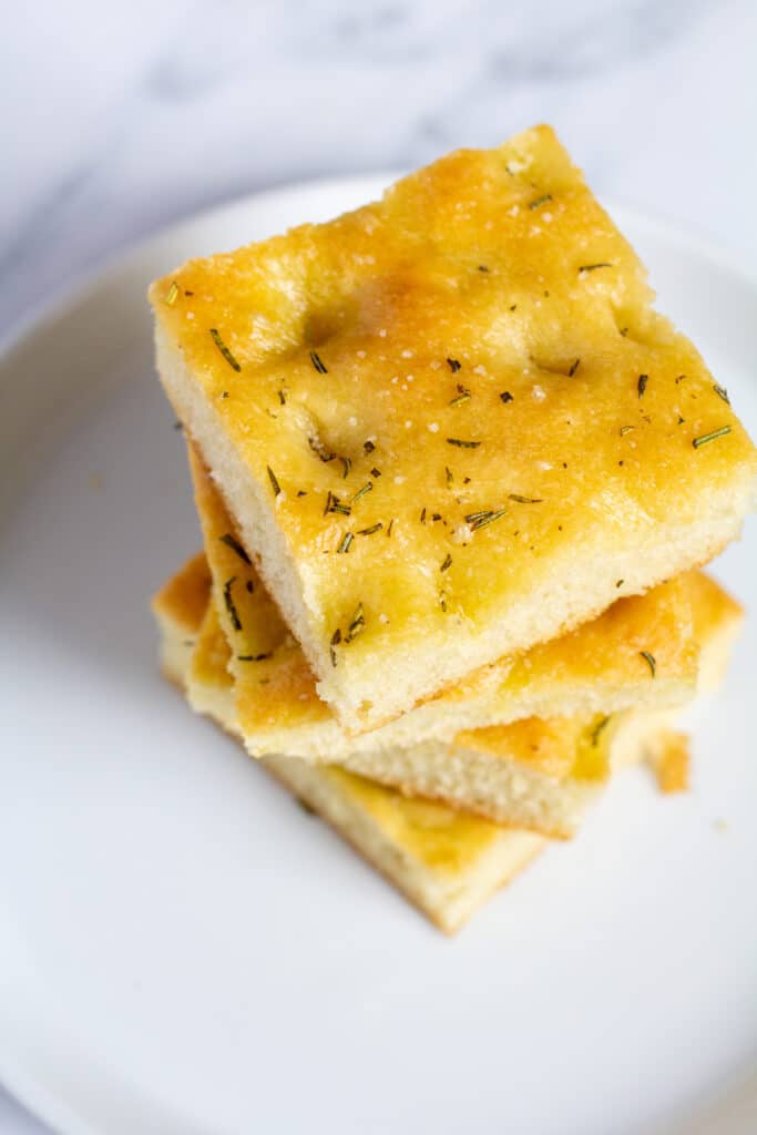 stacked pieces of bread on a white plate