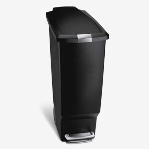 a black trashcan with a lid that raises by stepping on a device at the bottom